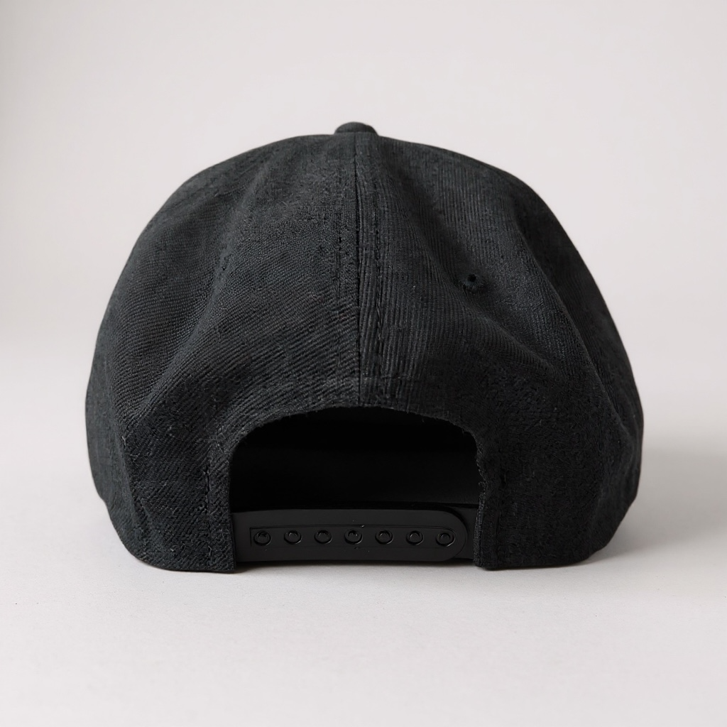 Rear view of a black Top Mount BJJ dad hat featuring an adjustable plastic snapback closure.