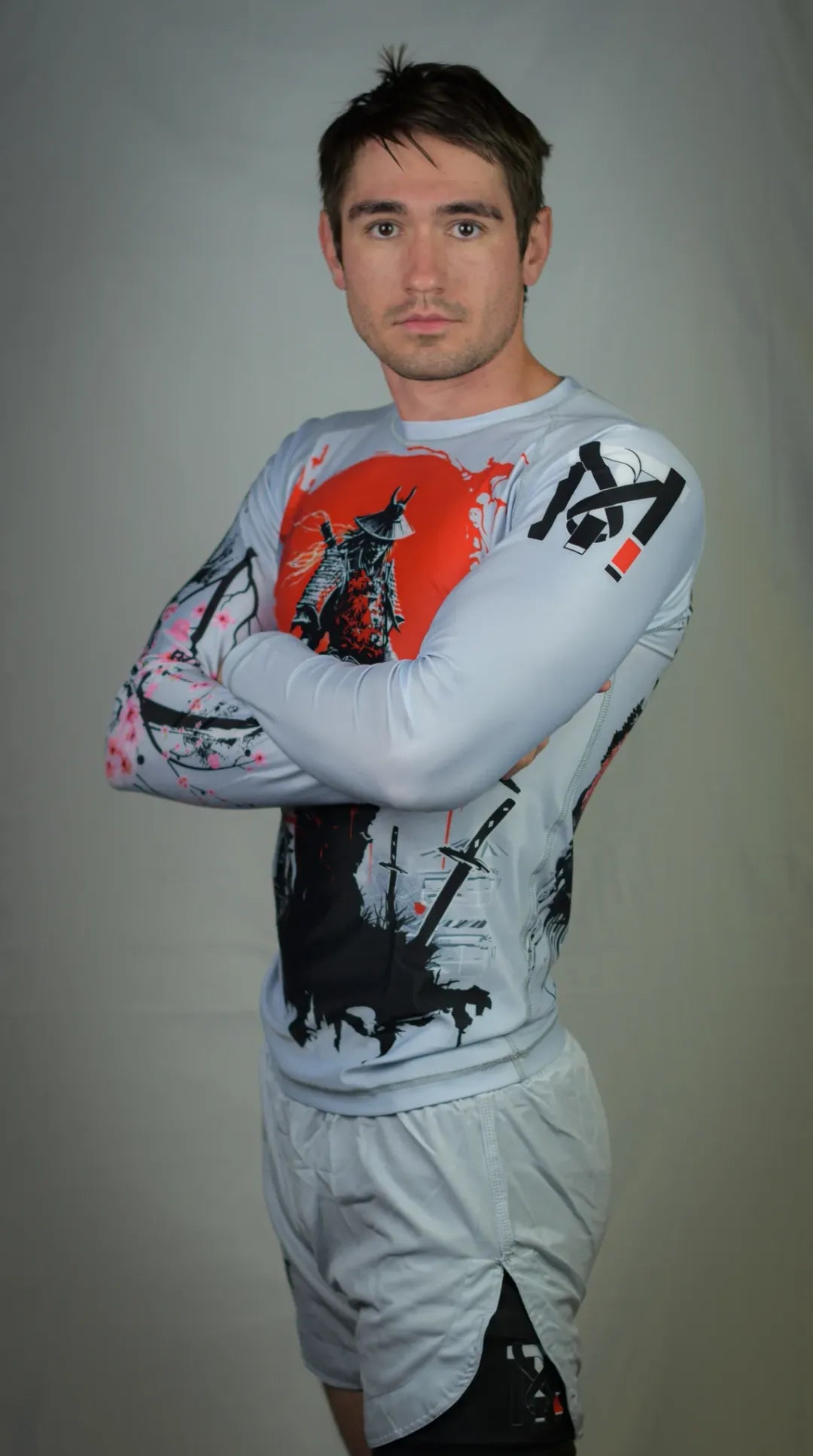 Youth Samurai BJJ rash guard and grappling shorts with black compression liner for martial arts training.