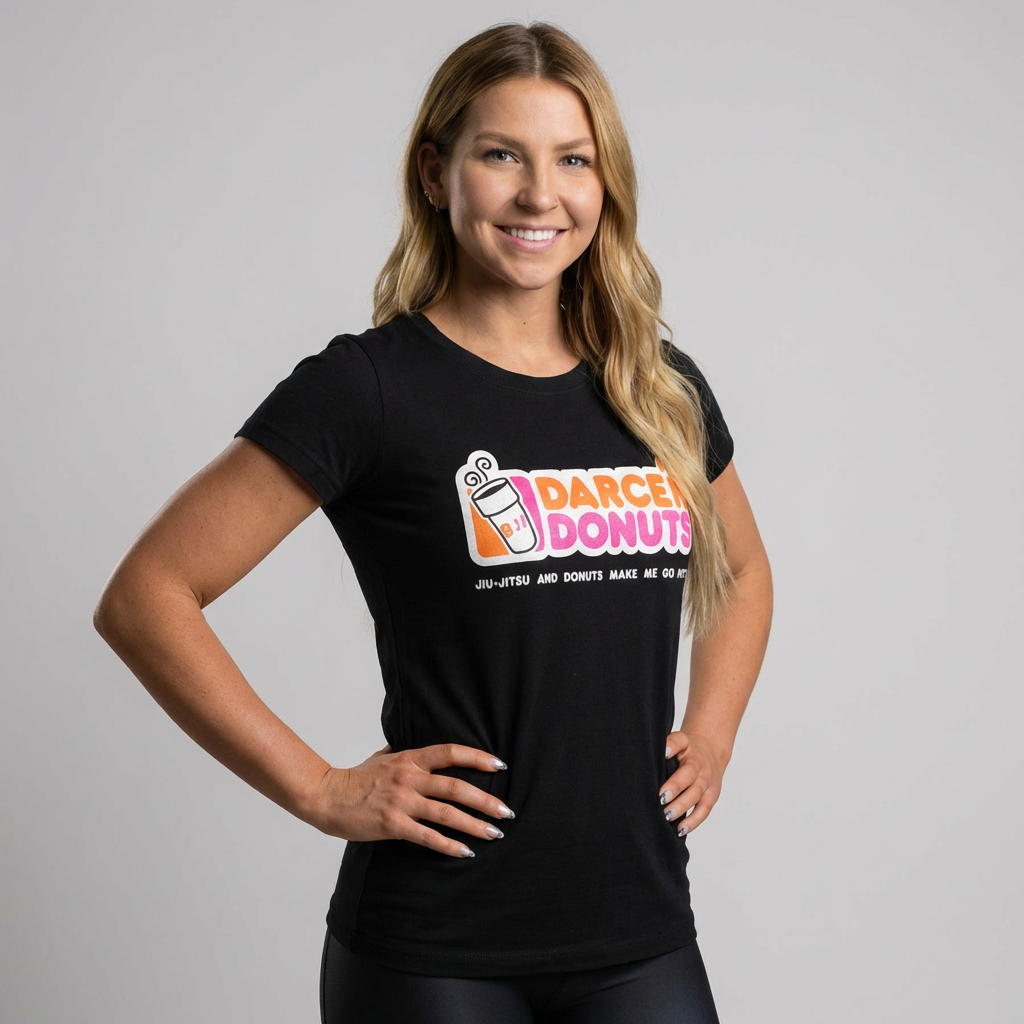 Smiling woman wearing the black Darce'N Donuts Women's BJJ Tee, a Jiu-Jitsu recovery lifestyle t-shirt.