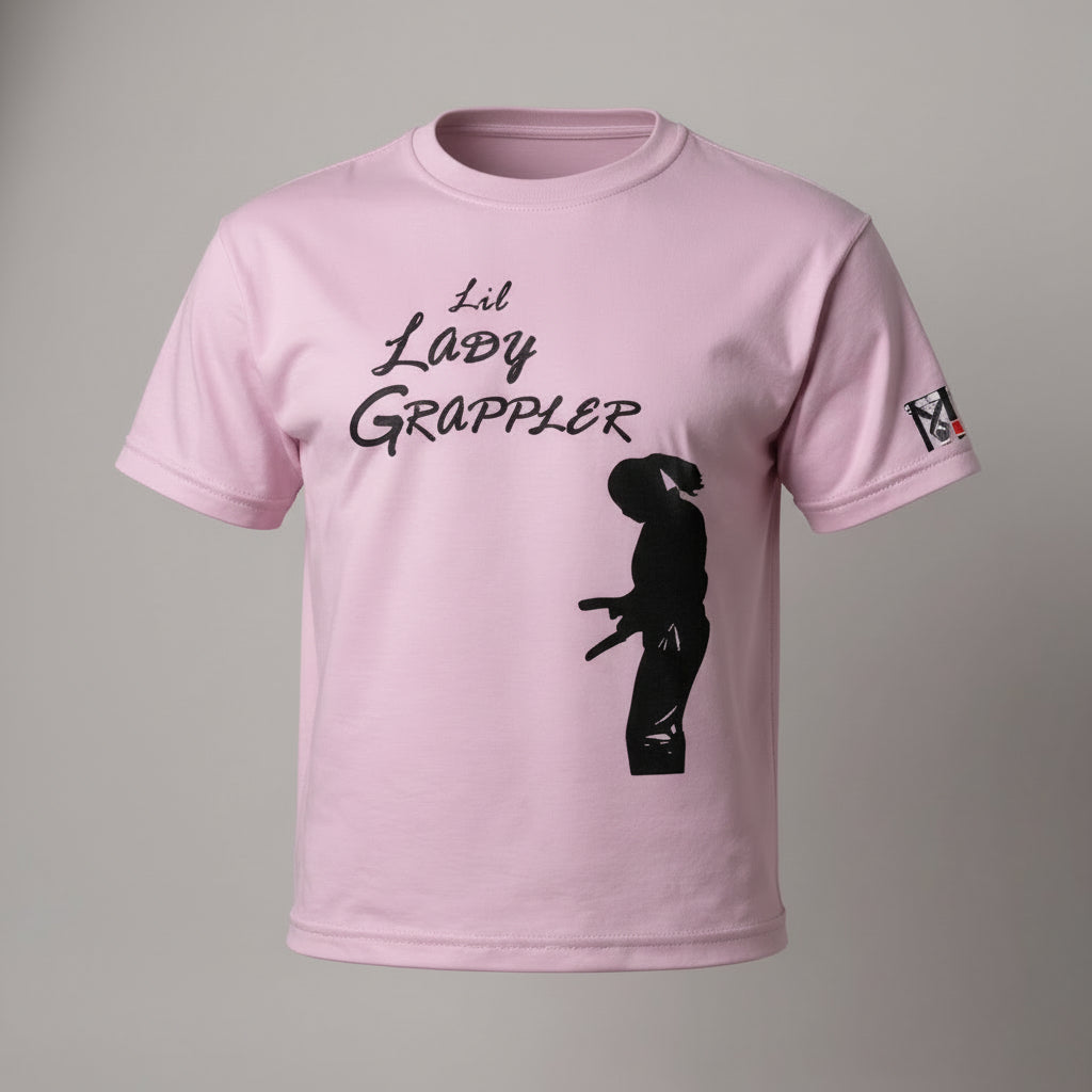 Pink Lil Lady Grappler Girls Jiu Jitsu Tee featuring a female fighter silhouette and Top Mount sleeve logo.
