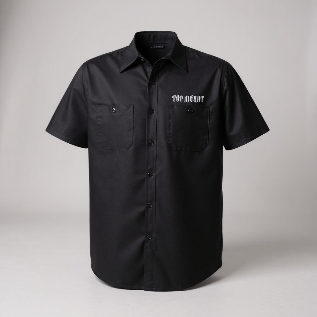 Black short-sleeve Mechanic Crew Work Shirt by Top Mount with white chest logo, button-down front, and dual utility pockets.