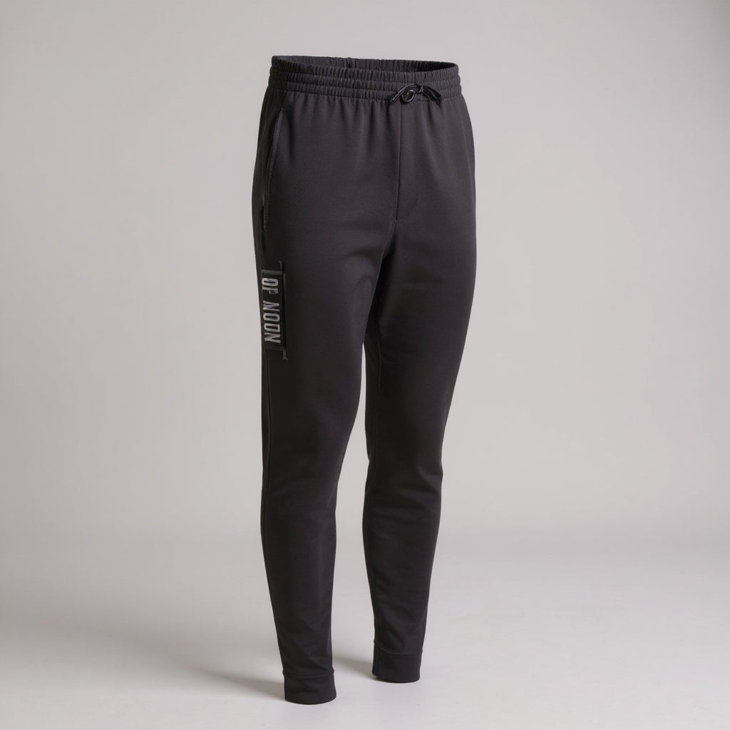 Top Mount black tapered fleece BJJ joggers with drawstring waist and vertical logo on the right thigh for training.