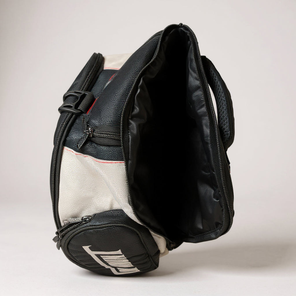 Open To The Top BJJ gym bag showing spacious main compartment, red stitching, and reinforced side pockets for MMA gear.