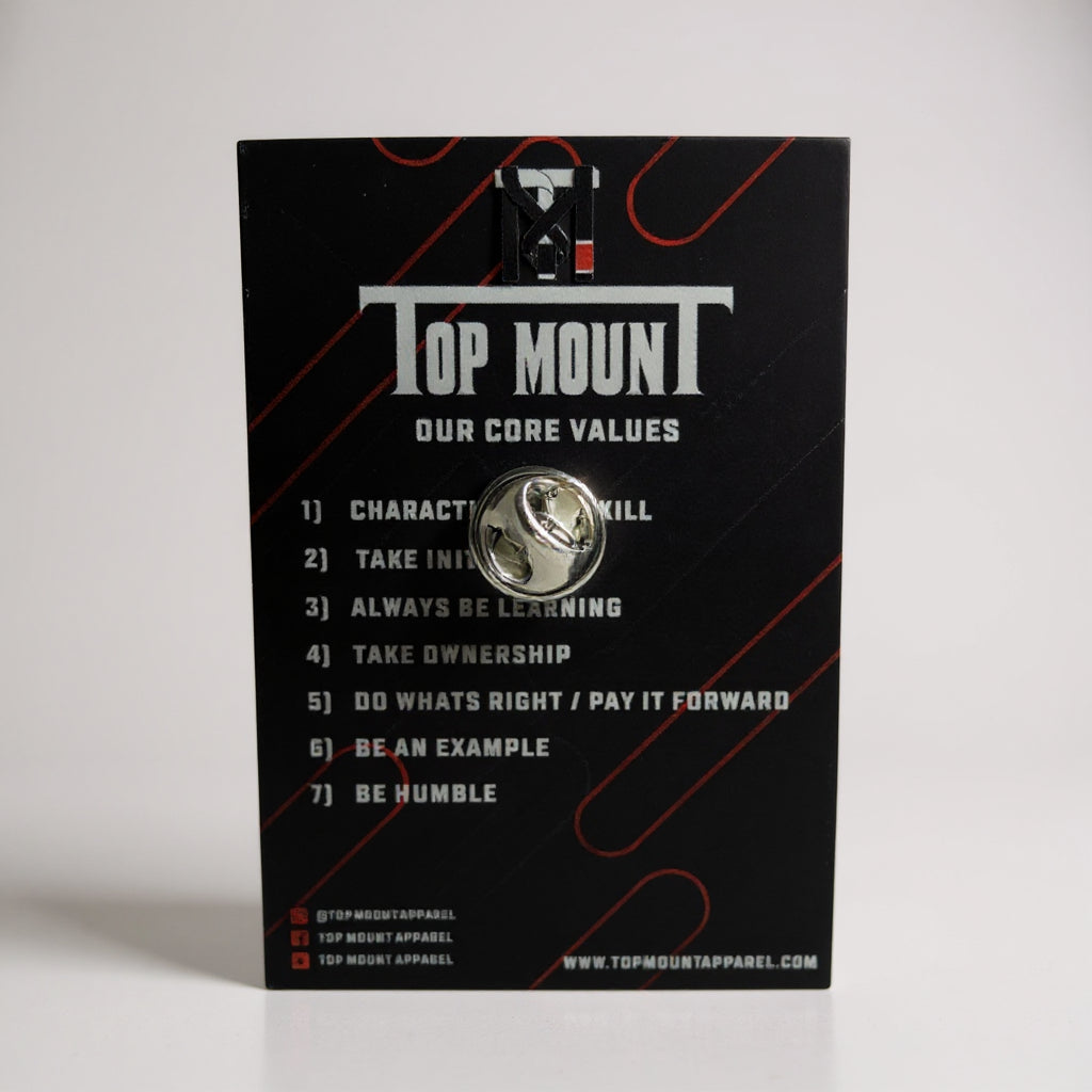BJJ Enamel Lapel Pin with butterfly clutch back on a black Top Mount Jiu Jitsu Core Values display card.