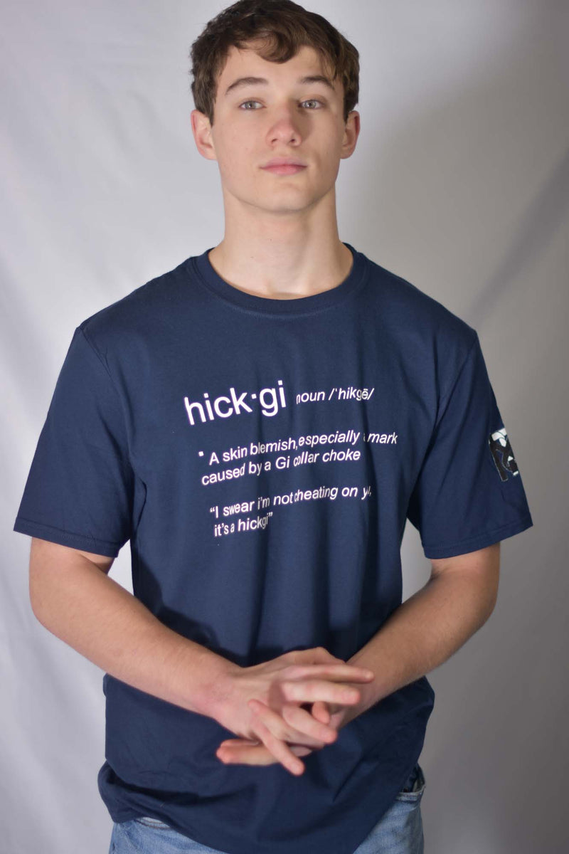 Model wearing navy Hick-Gi BJJ humor graphic tee by Top Mount featuring a funny dictionary definition and sleeve logo.