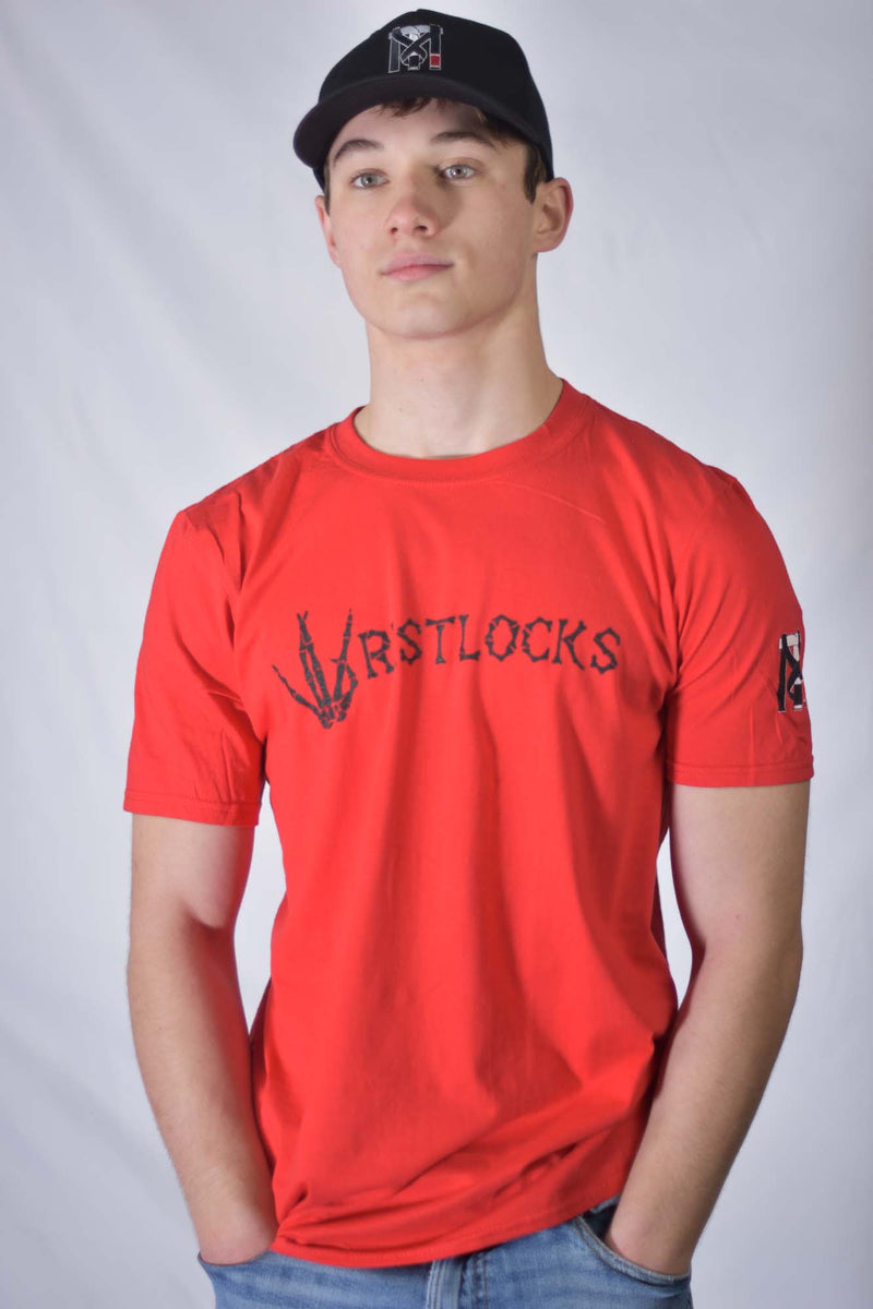 Man in the red Wristlocks BJJ Graphic Tee with skeleton hand West Side sign and Top Mount logo on the sleeve.