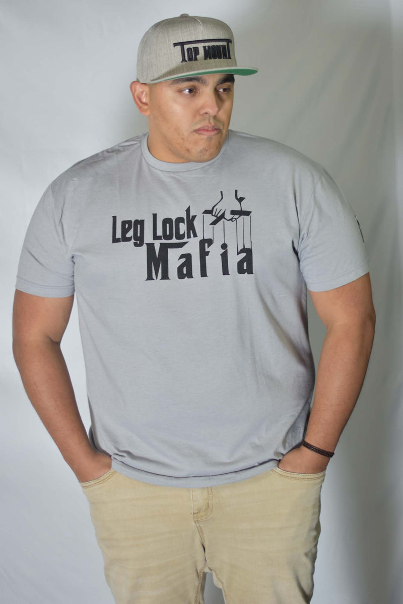 Man in gray Leg Lock Mafia BJJ Tee and Top Mount snapback hat. Grappling apparel for Brazilian Jiu Jitsu.